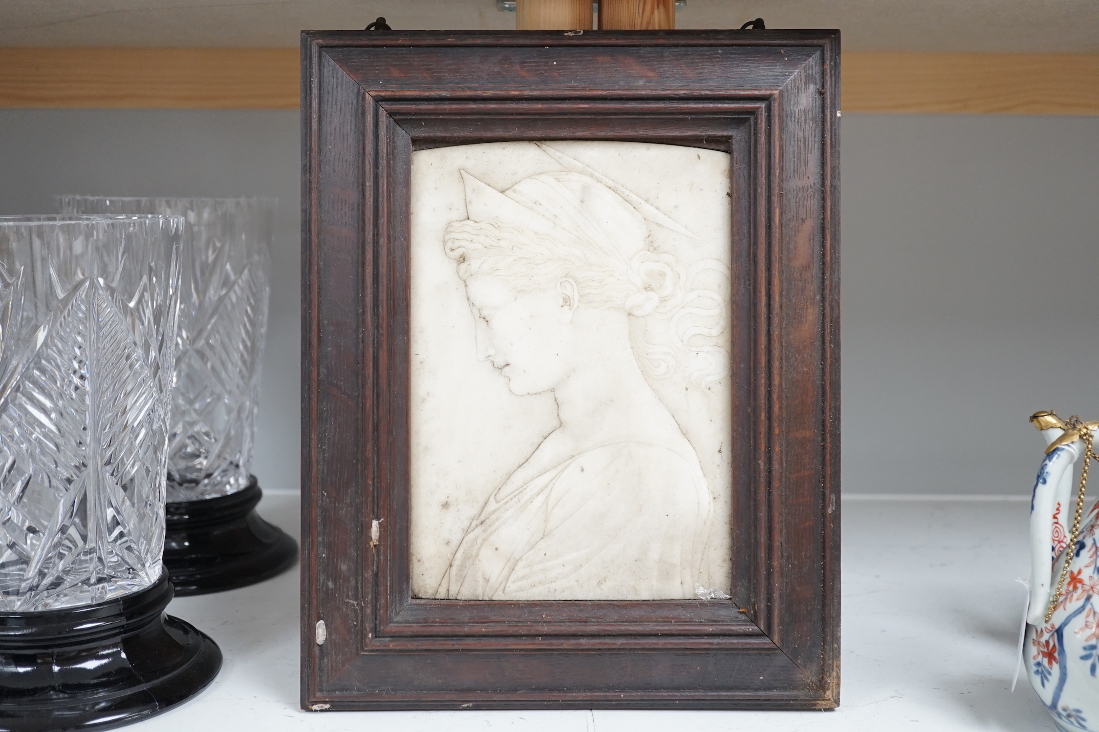 A framed and carved marble portrait relief, c.1900, 33x27cm